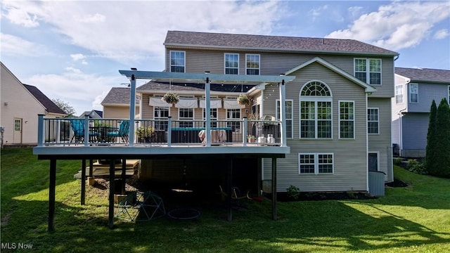 2720 Pinegate Dr, Norton, OH 44203 - back of property featuring a wooden deck, a lawn, and a pergola