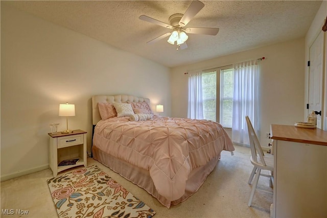 2720 Pinegate Dr, Norton, OH 44203 - bedroom featuring light carpet, a textured ceiling, and a ceiling fan