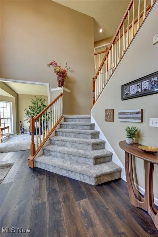 2720 Pinegate Dr, Norton, OH 44203 - stairway featuring wood finished floors, a high ceiling, and recessed lighting