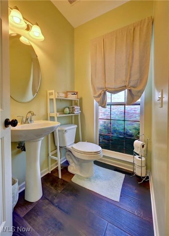 2720 Pinegate Dr, Norton, OH 44203 - half bath featuring wood finished floors and toilet