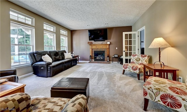 2720 Pinegate Dr, Norton, OH 44203 - carpeted living area with a textured ceiling and a fireplace