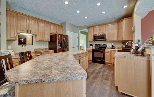 2720 Pinegate Dr, Norton, OH 44203 - kitchen with black electric range, stainless steel microwave, refrigerator with ice dispenser, light brown cabinetry, and light countertops