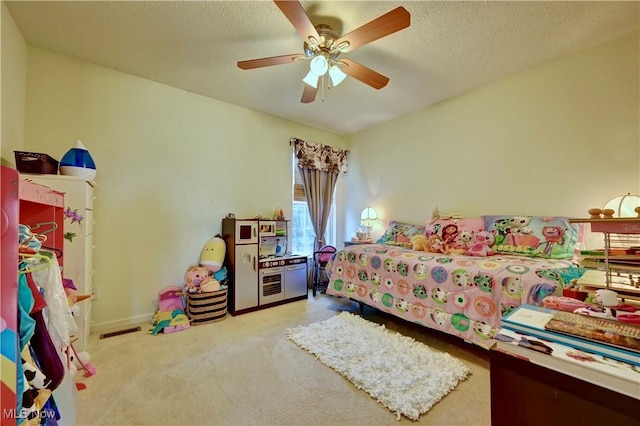 2720 Pinegate Dr, Norton, OH 44203 - carpeted bedroom featuring a ceiling fan and a textured ceiling