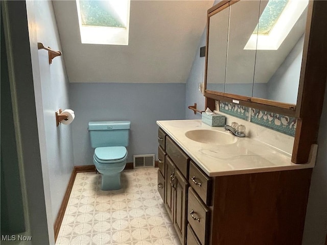 5450 King Graves Rd, Vienna, OH 44473 - bathroom featuring a skylight, vanity, and lofted ceiling