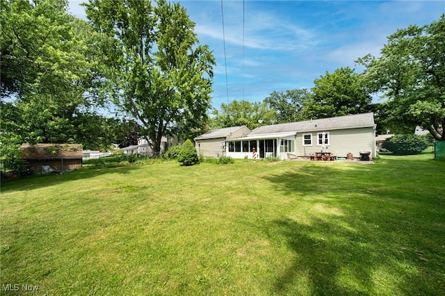 8218 Westmoor Rd, Mentor, OH 44060 - view of green lawn with a patio area