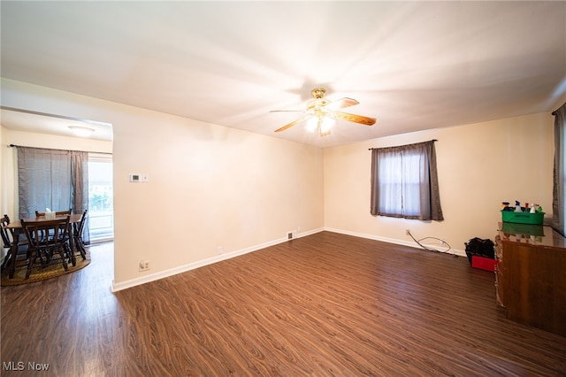 8218 Westmoor Rd, Mentor, OH 44060 - spare room with ceiling fan, dark wood-style flooring, and plenty of natural light