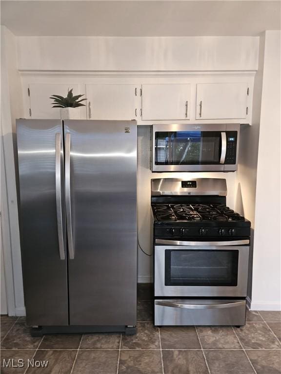 5711 W 54th St, Parma, OH 44129 - kitchen featuring stainless steel appliances and white cabinets