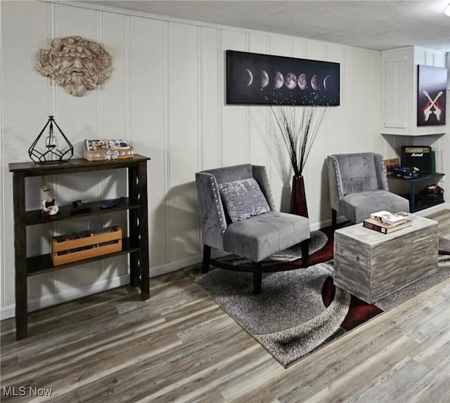 5711 W 54th St, Parma, OH 44129 - sitting room with wood finished floors and a decorative wall