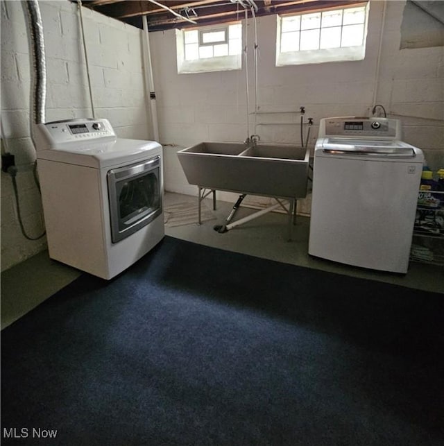 5711 W 54th St, Parma, OH 44129 - laundry room featuring washer and clothes dryer and plenty of natural light