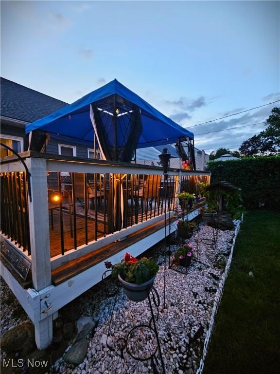 5711 W 54th St, Parma, OH 44129 - back of property at dusk with roof with shingles
