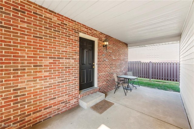 1234 W Maple St, North Canton, OH 44720 - entrance to property with covered porch and brick siding