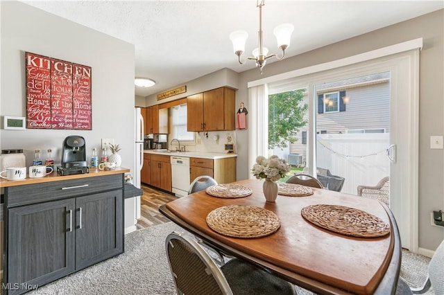 1234 W Maple St, North Canton, OH 44720 - dining space featuring a chandelier and light wood-style floors