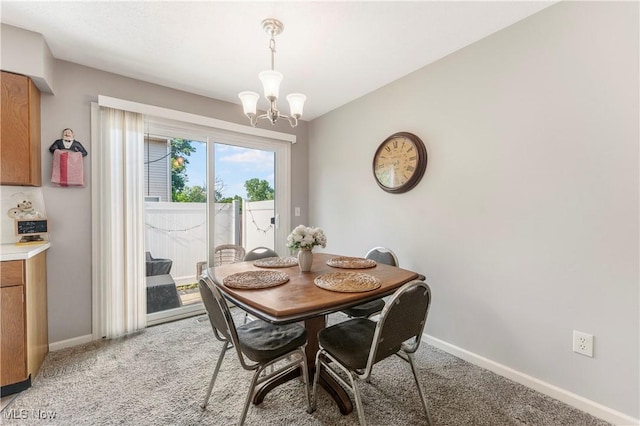 1234 W Maple St, North Canton, OH 44720 - dining space featuring a chandelier and light carpet