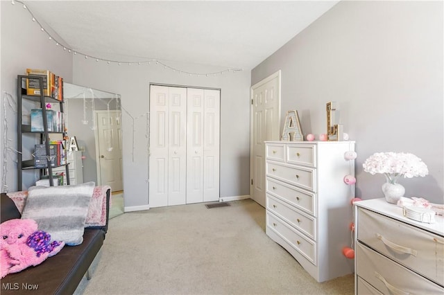 1234 W Maple St, North Canton, OH 44720 - bedroom with light carpet and a closet