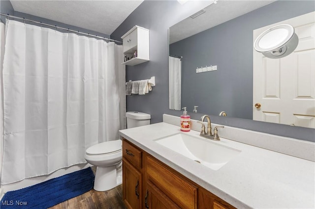 1234 W Maple St, North Canton, OH 44720 - bathroom featuring wood finished floors, vanity, and a shower with curtain