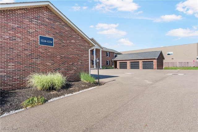 1234 W Maple St, North Canton, OH 44720 - view of building exterior featuring a garage