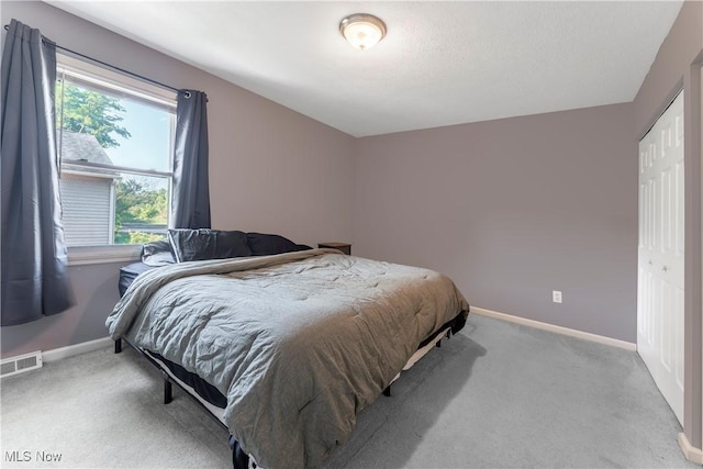 1234 W Maple St, North Canton, OH 44720 - carpeted bedroom with baseboards and a closet