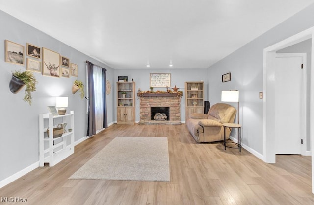 201 Noble St W, East Canton, OH 44730 - living room with light wood-style flooring and a stone fireplace