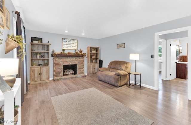 201 Noble St W, East Canton, OH 44730 - living area featuring wood finished floors, recessed lighting, and a fireplace