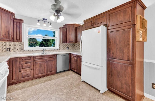 201 Noble St W, East Canton, OH 44730 - kitchen featuring stainless steel dishwasher, freestanding refrigerator, stove, backsplash, and ceiling fan
