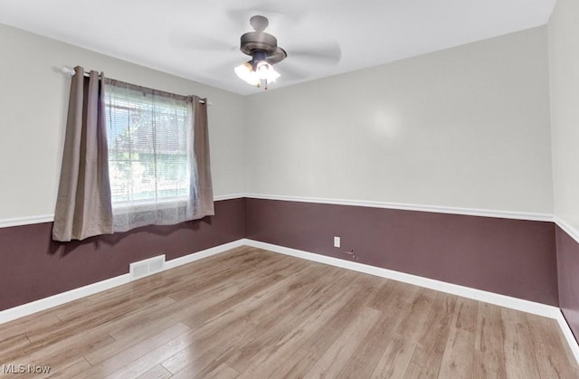 201 Noble St W, East Canton, OH 44730 - spare room with wood finished floors and ceiling fan