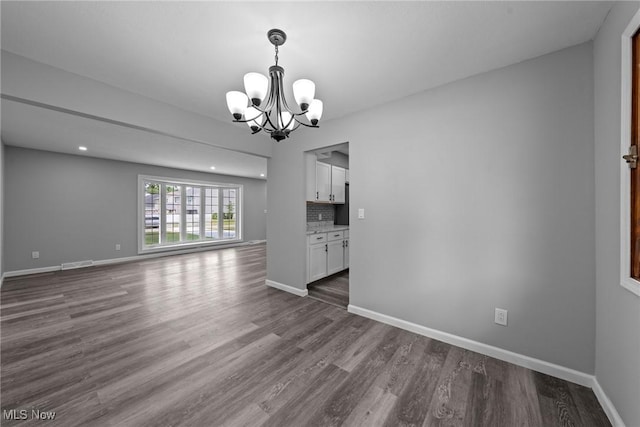 1303 E Dartmoor Ave, Seven Hills, OH 44131 - unfurnished dining area with a chandelier, dark wood-type flooring, and recessed lighting