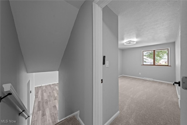 1303 E Dartmoor Ave, Seven Hills, OH 44131 - staircase with carpet flooring and a textured ceiling