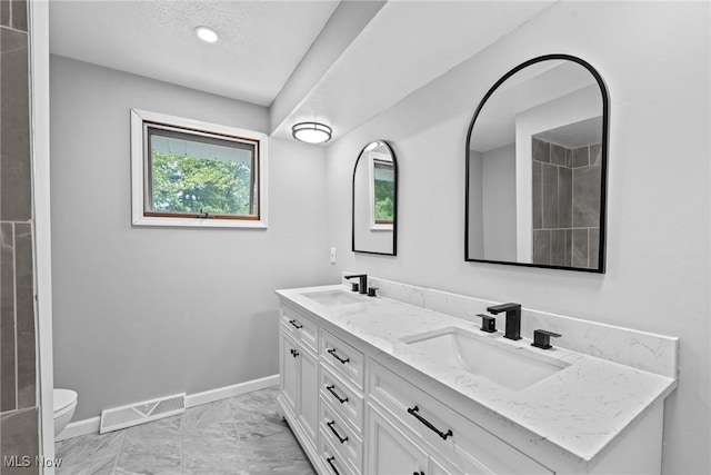 1303 E Dartmoor Ave, Seven Hills, OH 44131 - bathroom featuring double vanity and marble finish floors