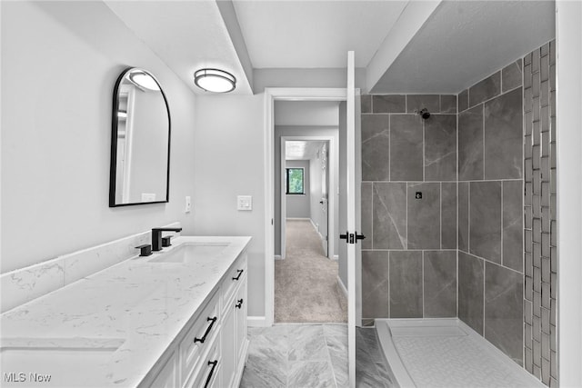 1303 E Dartmoor Ave, Seven Hills, OH 44131 - full bath featuring vanity, marble look tiles, and a tile shower