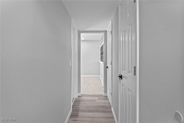 1303 E Dartmoor Ave, Seven Hills, OH 44131 - corridor featuring baseboards and wood finished floors