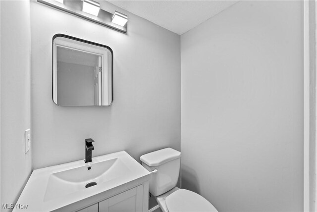 1303 E Dartmoor Ave, Seven Hills, OH 44131 - bathroom featuring toilet and vanity
