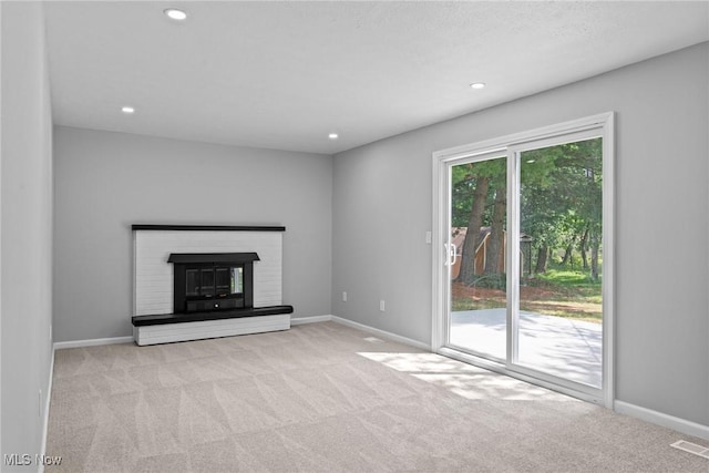 1303 E Dartmoor Ave, Seven Hills, OH 44131 - unfurnished living room with carpet floors, recessed lighting, and a fireplace