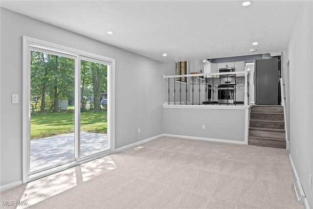 1303 E Dartmoor Ave, Seven Hills, OH 44131 - unfurnished living room featuring carpet floors and recessed lighting