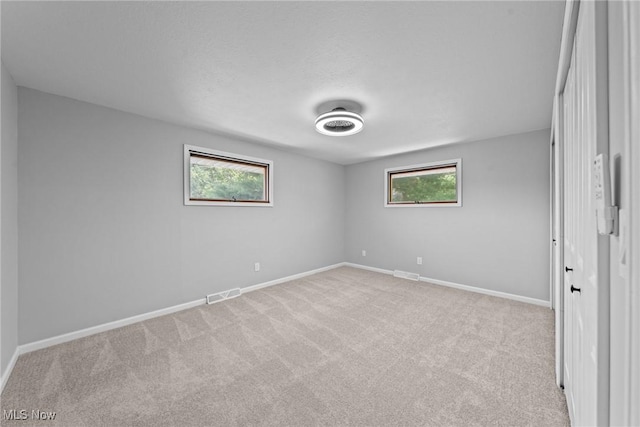 1303 E Dartmoor Ave, Seven Hills, OH 44131 - unfurnished room with light colored carpet and plenty of natural light