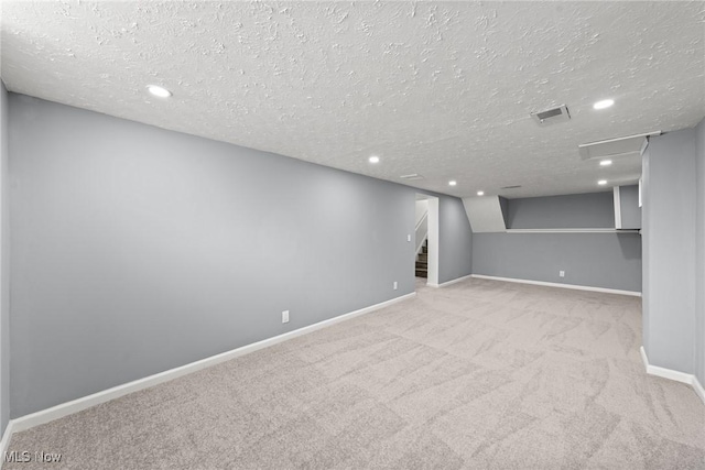1303 E Dartmoor Ave, Seven Hills, OH 44131 - finished below grade area featuring a textured ceiling, carpet floors, stairway, and recessed lighting