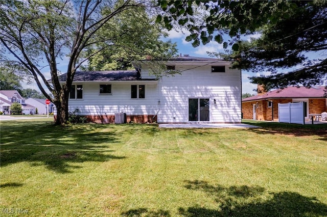 1303 E Dartmoor Ave, Seven Hills, OH 44131 - back of property featuring a lawn and a patio area