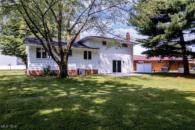 1303 E Dartmoor Ave, Seven Hills, OH 44131 - back of property featuring a chimney and a patio