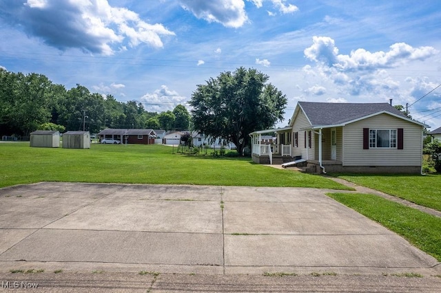 1320 21st St, Vienna, WV 26105 - view of green lawn with a storage unit