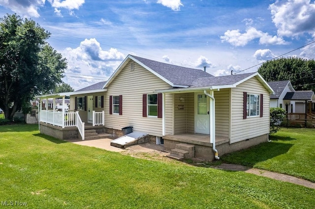 1320 21st St, Vienna, WV 26105 - rear view of house with a lawn, a shingled roof, and a porch