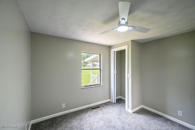 1320 21st St, Vienna, WV 26105 - unfurnished bedroom with carpet floors and a ceiling fan
