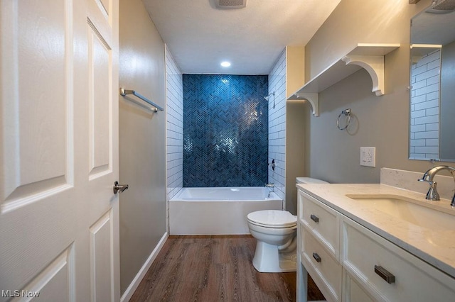 1320 21st St, Vienna, WV 26105 - bathroom with wood finished floors, vanity, and washtub / shower combination