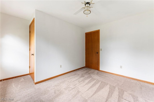 9852 Hocking St NW, Massillon, OH 44646 - unfurnished room featuring light colored carpet and a ceiling fan