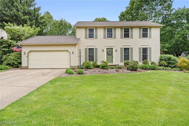 9852 Hocking St NW, Massillon, OH 44646 - colonial inspired home with an attached garage, concrete driveway, and a front lawn