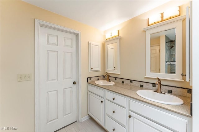9852 Hocking St NW, Massillon, OH 44646 - bathroom with double vanity and tile patterned flooring