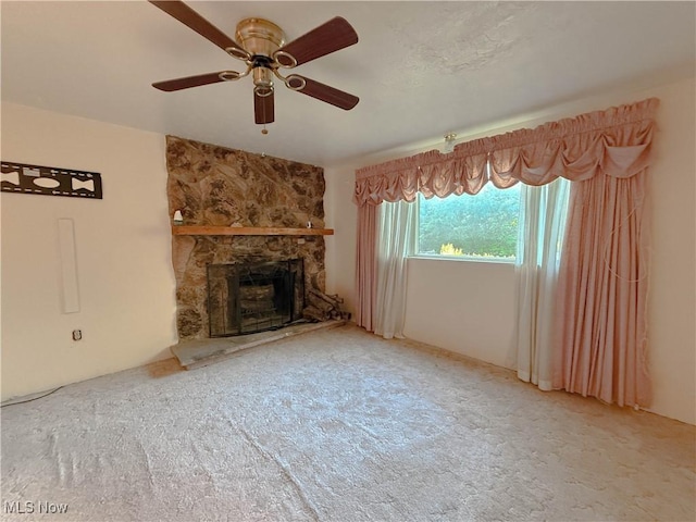 8756 Cook Rd, Salem, OH 44460 - unfurnished living room featuring a fireplace, carpet, and ceiling fan