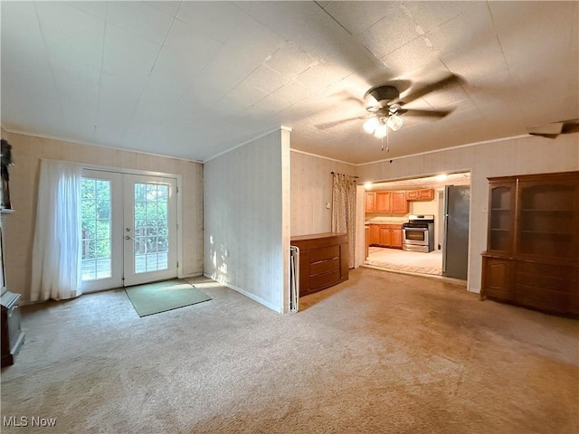 8756 Cook Rd, Salem, OH 44460 - unfurnished living room with french doors, light colored carpet, ceiling fan, and ornamental molding