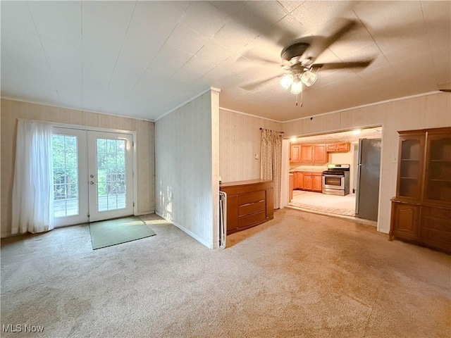 8756 Cook Rd, Salem, OH 44460 - unfurnished living room with ceiling fan, light colored carpet, french doors, and crown molding