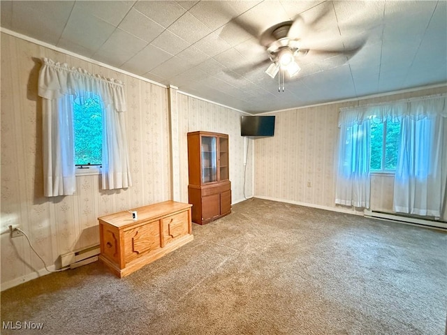 8756 Cook Rd, Salem, OH 44460 - carpeted spare room with plenty of natural light, a baseboard radiator, a ceiling fan, wallpapered walls, and ornamental molding
