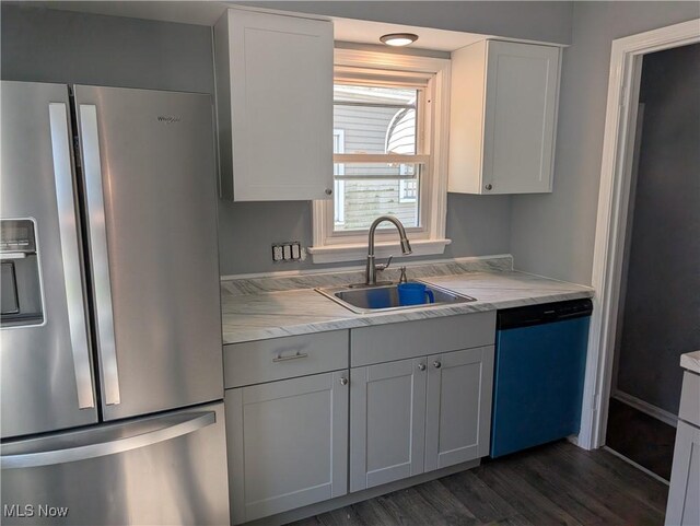 1146 Easton Dr, Akron, OH 44310 - kitchen with stainless steel fridge with ice dispenser, dishwashing machine, dark wood finished floors, and white cabinetry