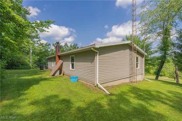 2176 Pageant Rd SE, Carrollton, OH 44615 - view of side of property featuring a yard and a chimney
